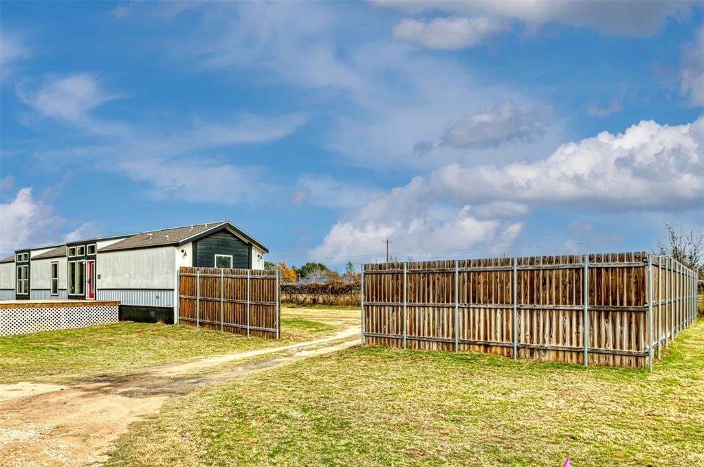 6715 Timberhaven Court Granbury, TX 76049 - Photo 5 of 40 a view of a house with a swimming pool