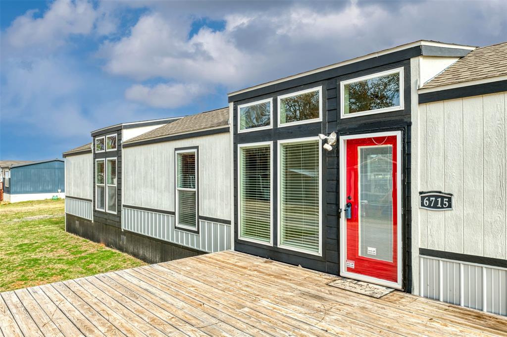 6715 Timberhaven Court Granbury, TX 76049 - Photo 7 of 40 a view of a house with a backyard