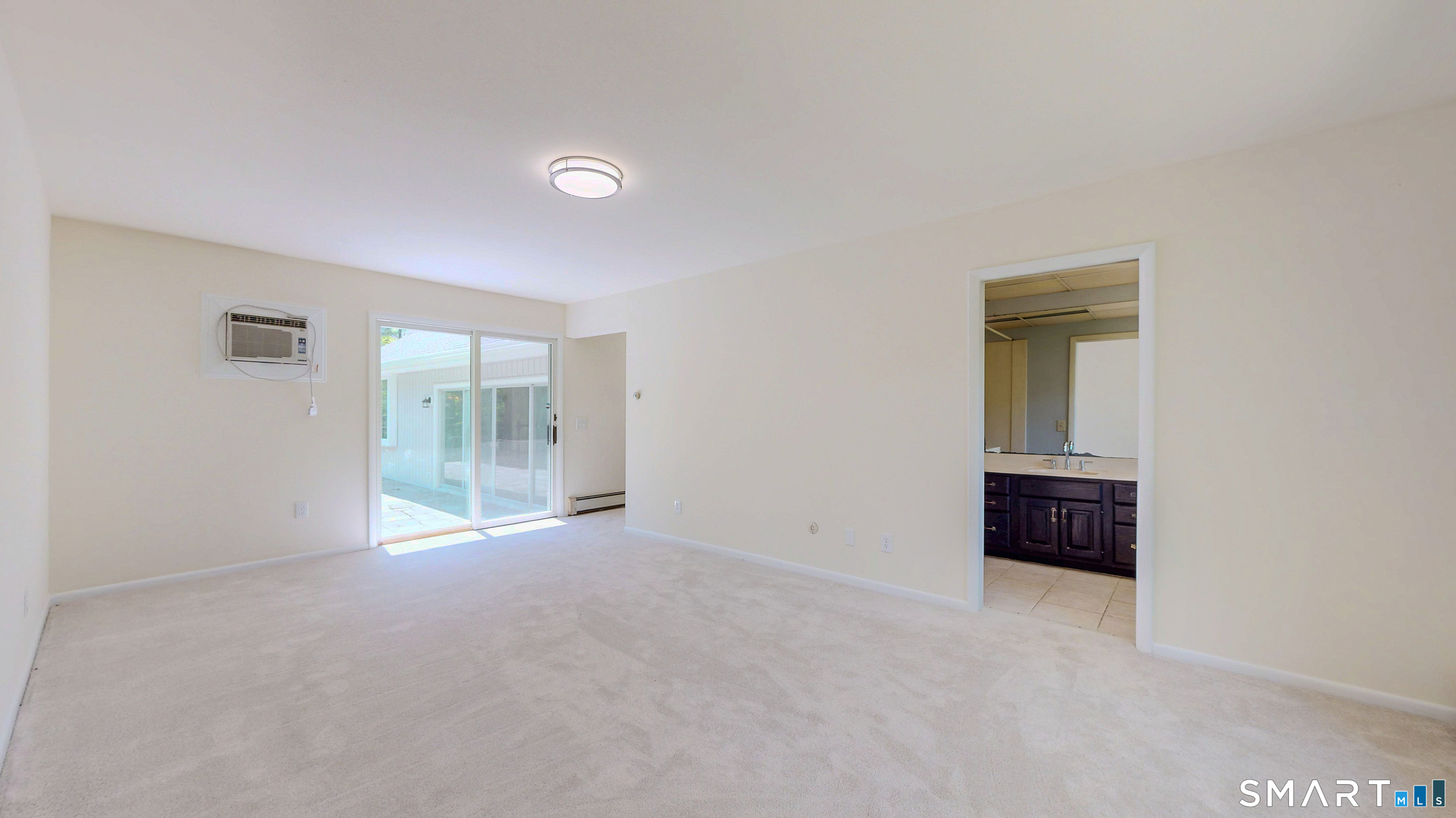 133 Chambers Road Danbury, CT 06811 - Photo 16 of 30 an empty room with floor to ceiling window and outdoor view