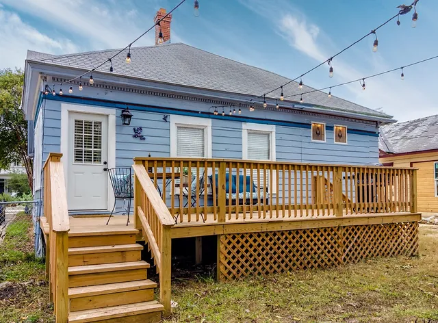 a front view of a house with a deck
