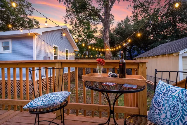 a view of a patio with a table chairs and a table