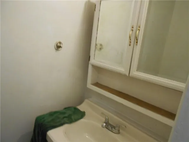 a view of a room with windows and tub