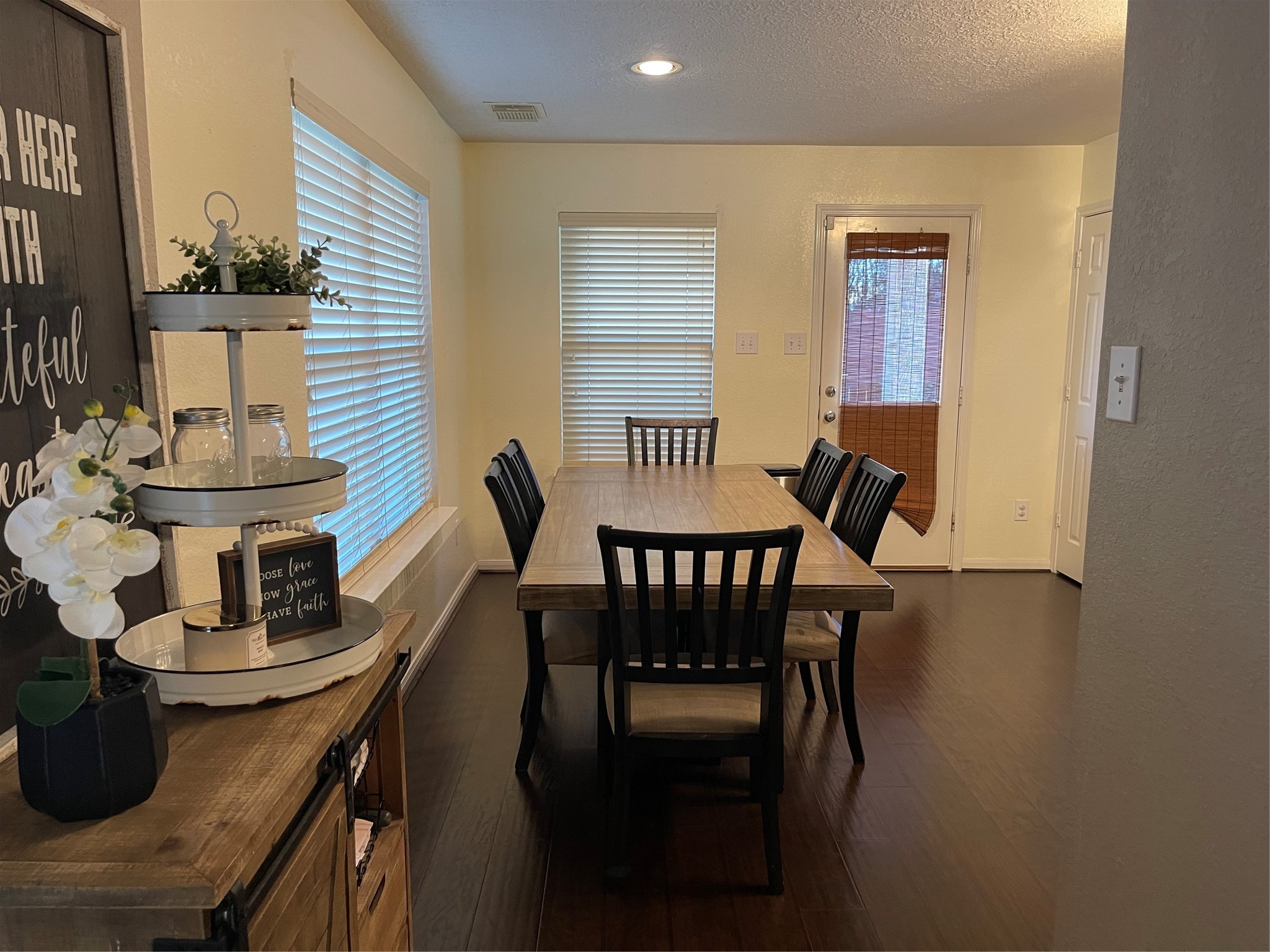 3310 Legends Wild Drive Spring, TX 77386 - Photo 14 of 40 a view of a dining room with furniture and wooden floor