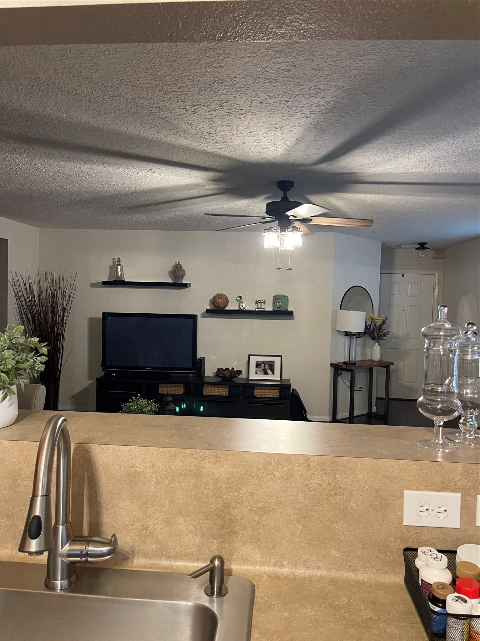 3310 Legends Wild Drive Spring, TX 77386 - Photo 16 of 40 a kitchen with a sink and a fireplace