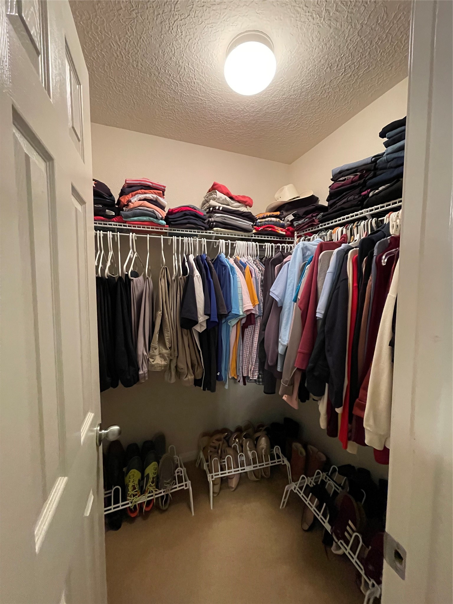 3310 Legends Wild Drive Spring, TX 77386 - Photo 20 of 40 a view of walk in closet with clothes and shoes
