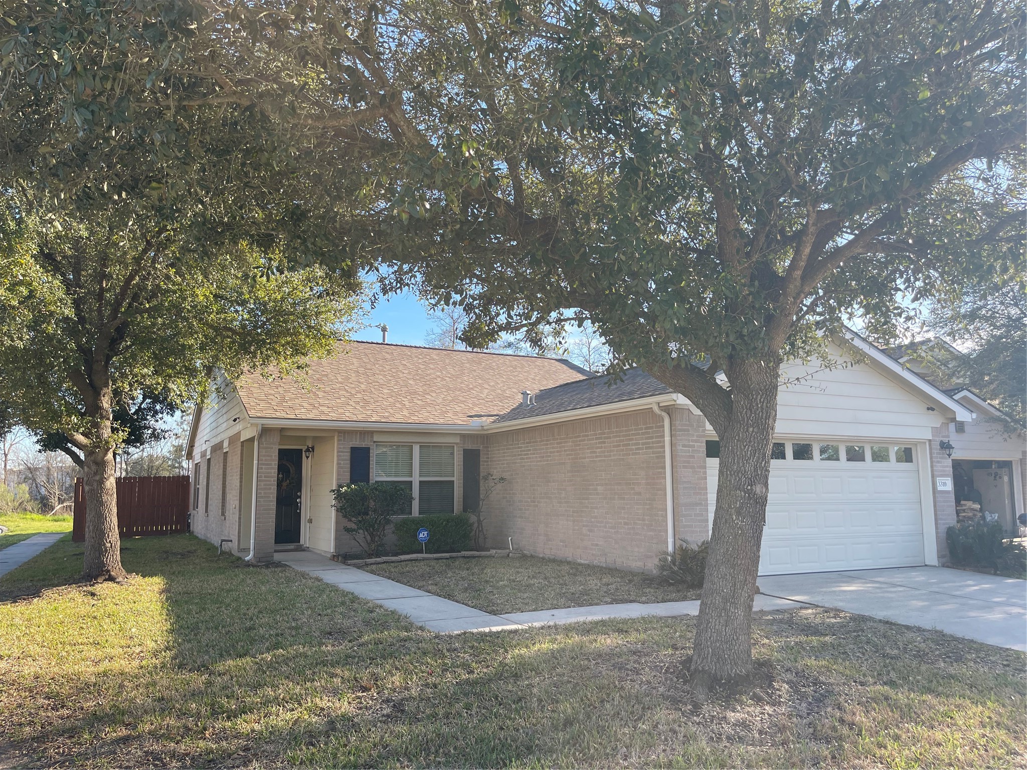 3310 Legends Wild Drive Spring, TX 77386 - Photo 2 of 40 a front view of a house with a yard and garage