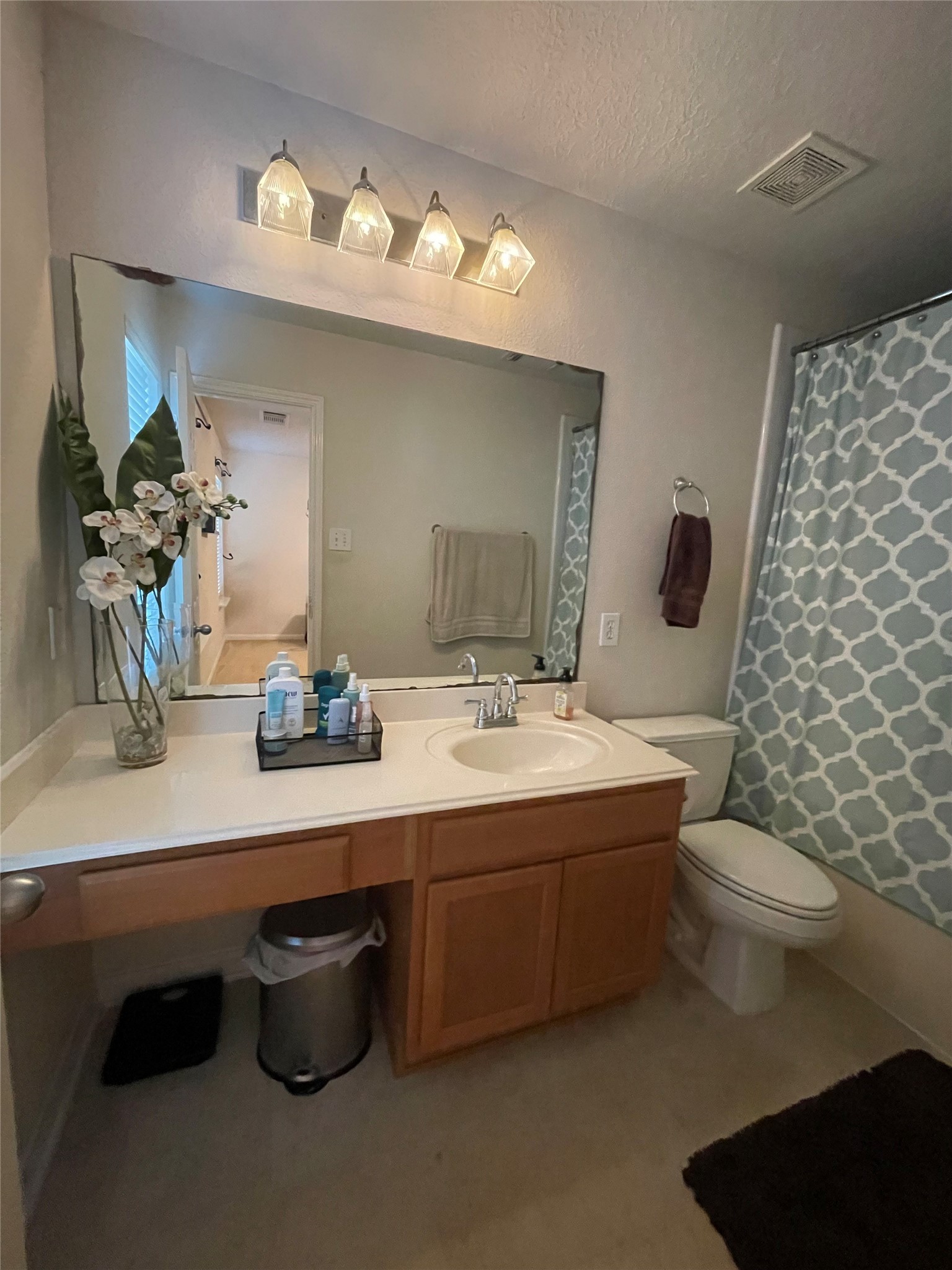 3310 Legends Wild Drive Spring, TX 77386 - Photo 21 of 40 a bathroom with a toilet sink and mirror