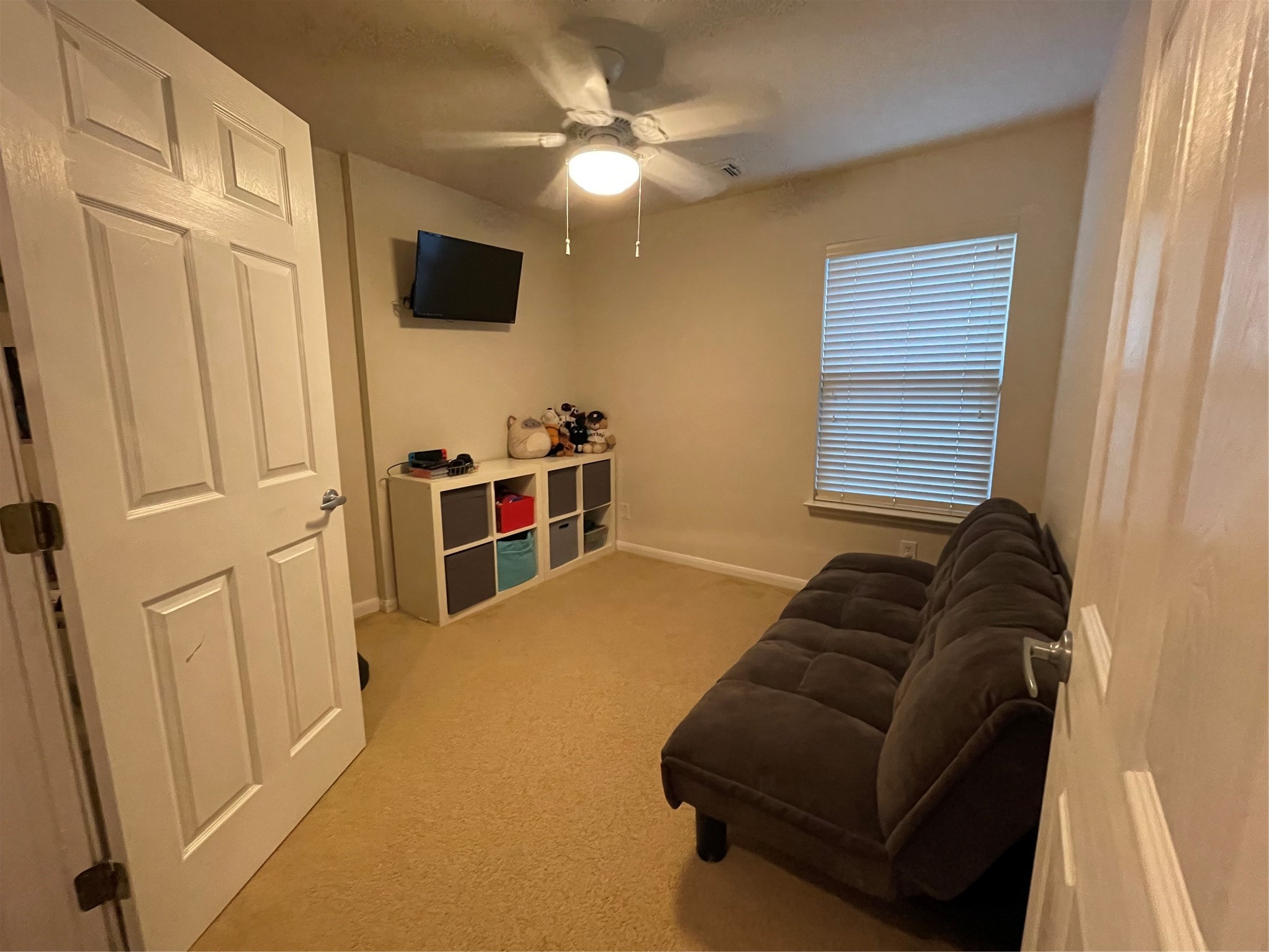 3310 Legends Wild Drive Spring, TX 77386 - Photo 27 of 40 a living room with furniture and a flat screen tv