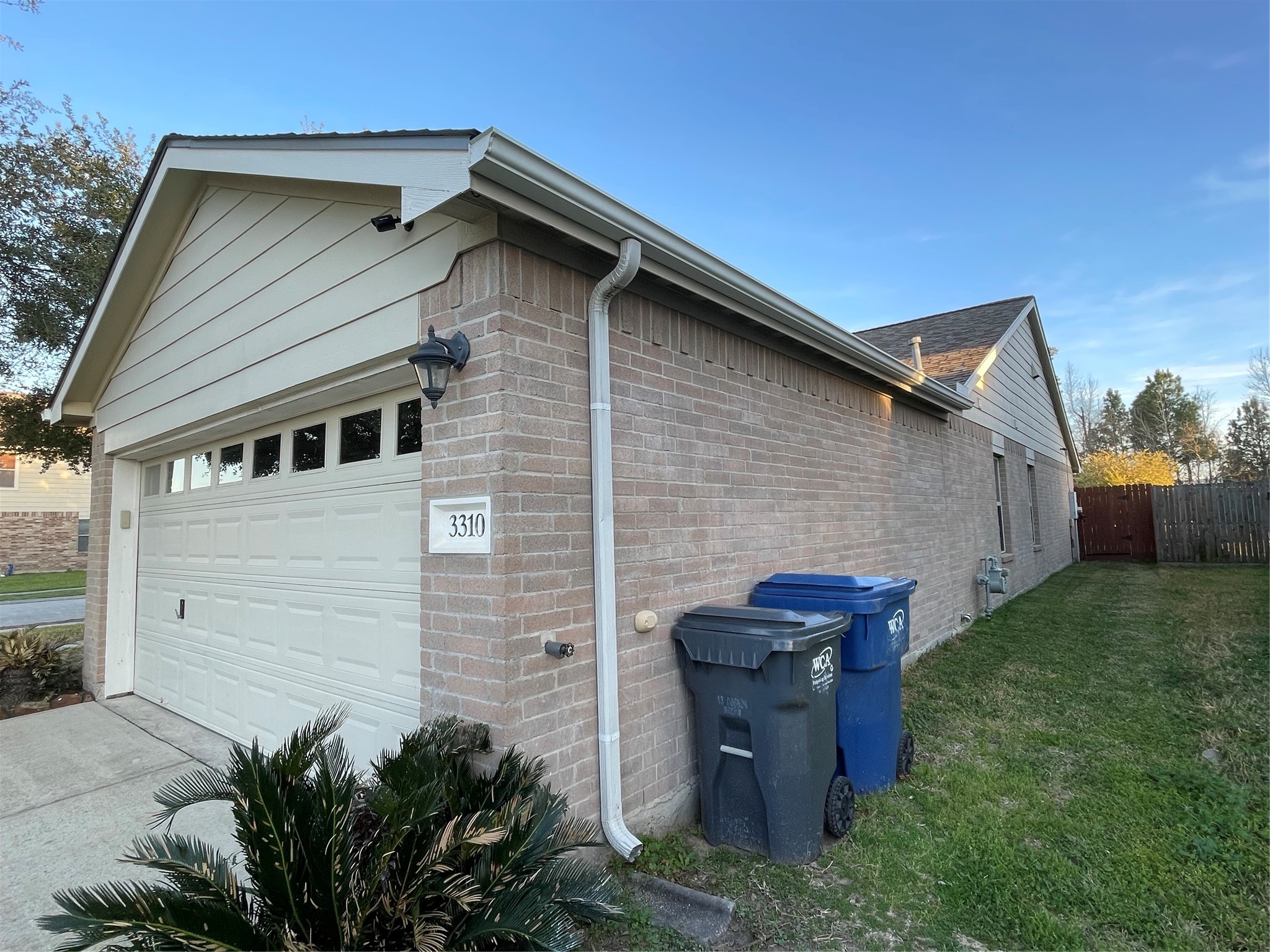3310 Legends Wild Drive Spring, TX 77386 - Photo 40 of 40 a backyard of a house with plants and barbeque oven