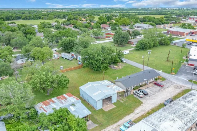 an aerial view of a house with a garden