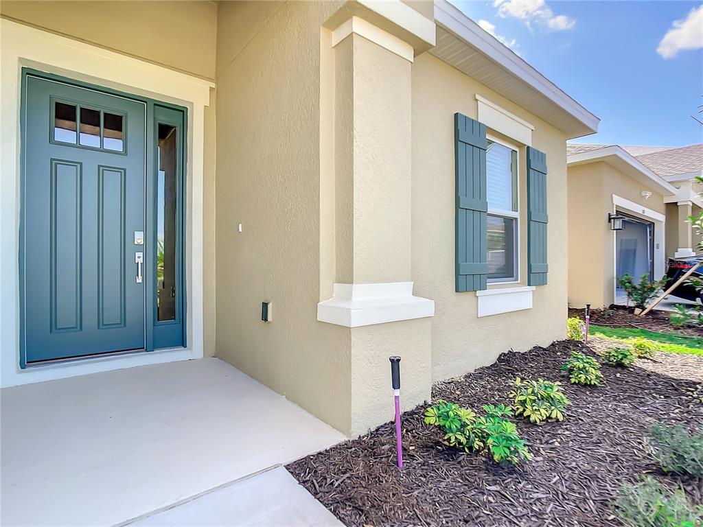 2675 Ridgetop Lane Clermont, FL 34711 - Photo 11 of 56 a front view of a house with garden