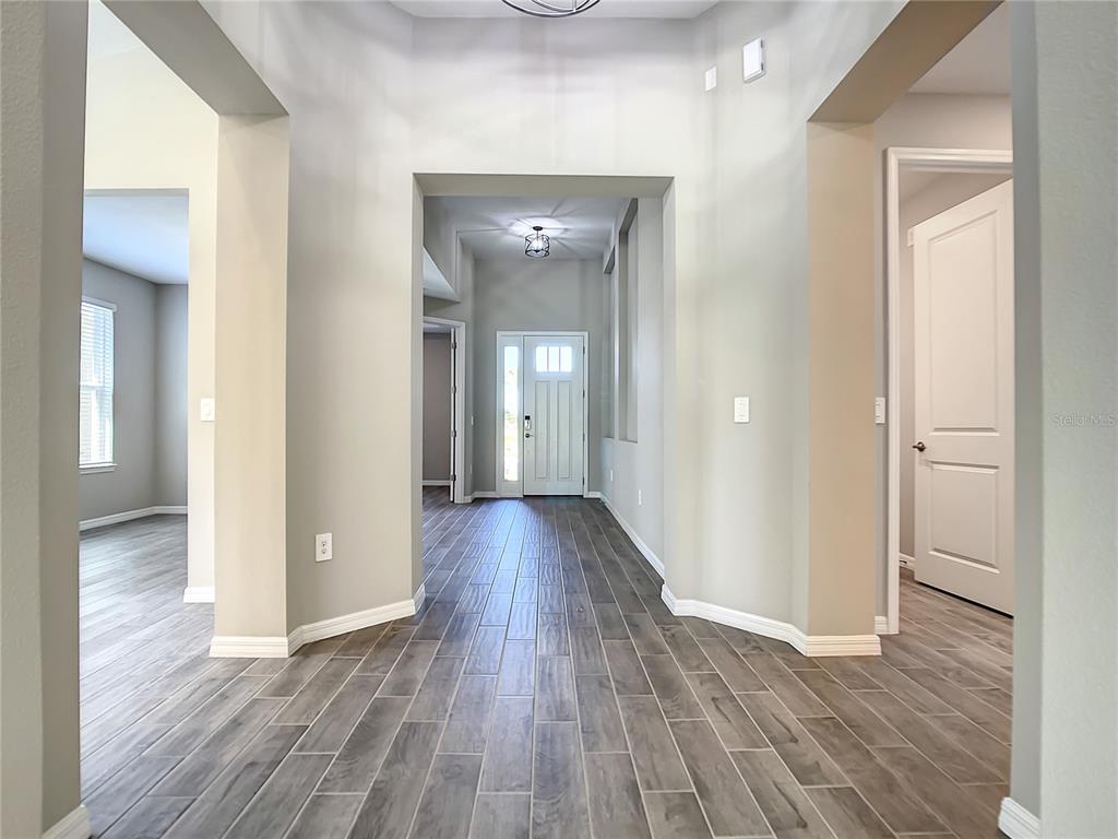 2675 Ridgetop Lane Clermont, FL 34711 - Photo 25 of 56 a view of hallway with wooden floor