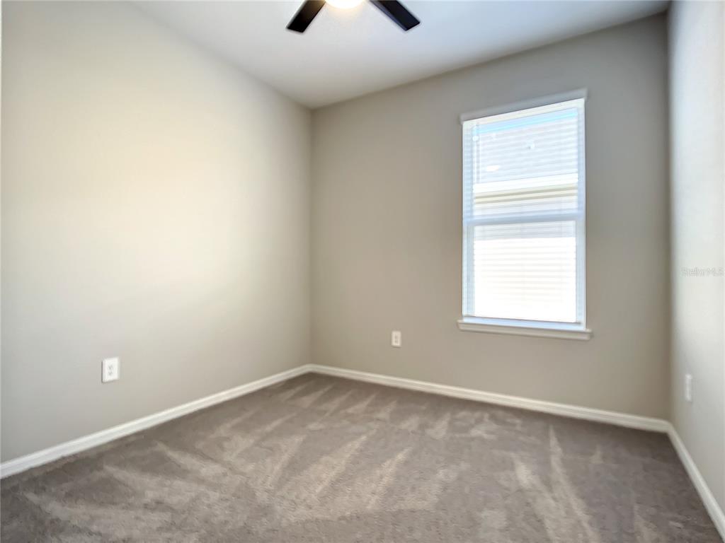 2675 Ridgetop Lane Clermont, FL 34711 - Photo 39 of 56 an empty room with a window