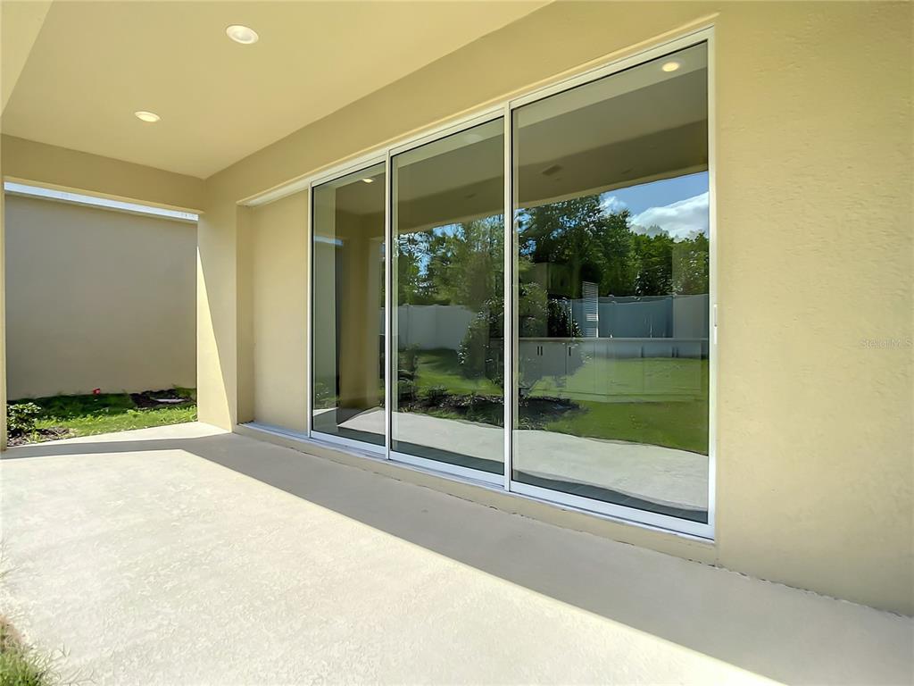 2675 Ridgetop Lane Clermont, FL 34711 - Photo 53 of 56 a view of a glass door with a glass door