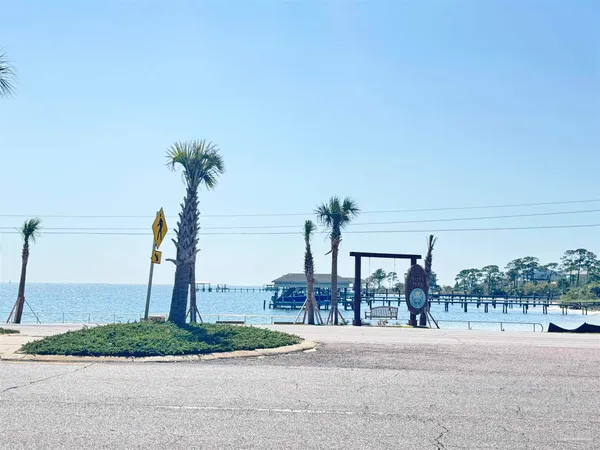 a view of a street with a ocean view