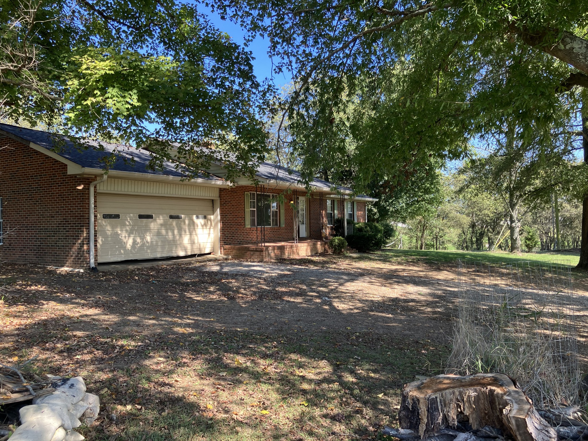 3411 Booker Ridge Road Mount Pleasant, TN 38474 - Photo 11 of 13 a view of a house with a yard and garage