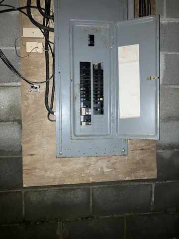 a bathroom with a granite countertop sink and mirror