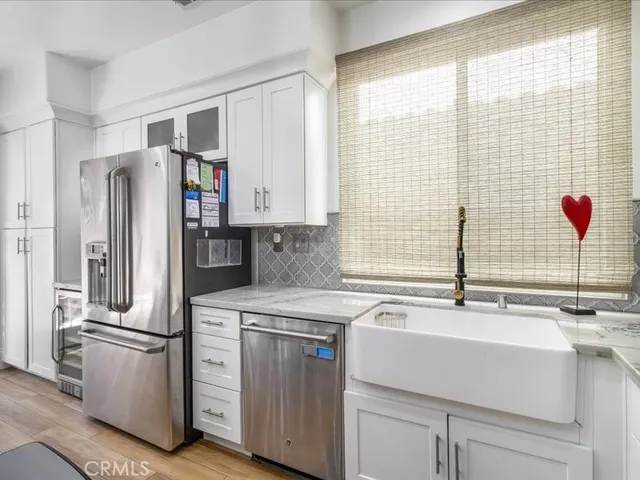 a living room with fireplace furniture and a flat screen tv