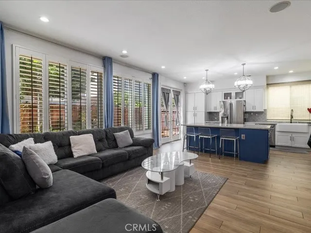 a bedroom with bed and a potted plant