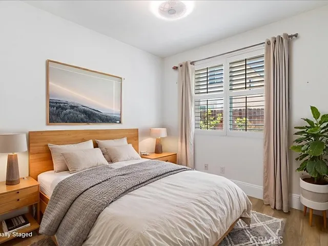a view of a workspace with furniture and a bookshelf