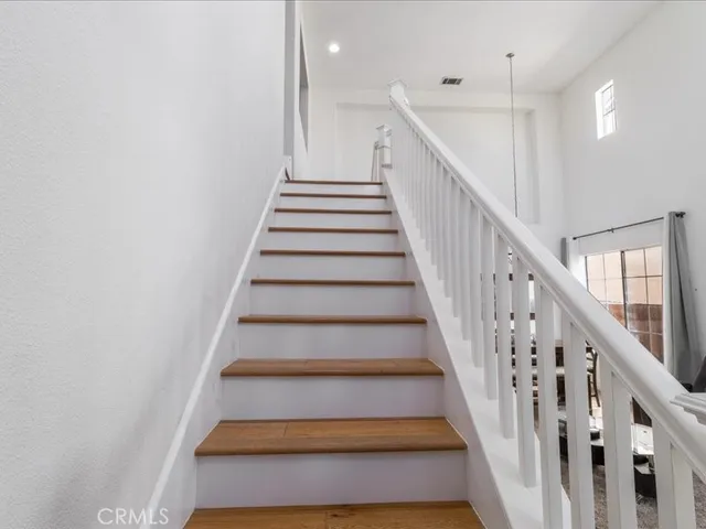 a spacious bathroom with a granite countertop sink mirror and a