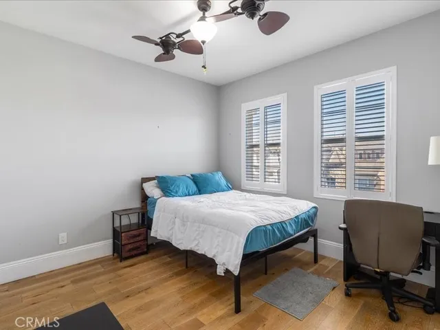 a view of a patio with couches table and chairs and potted plants