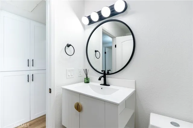 a bathroom with a sink and a mirror