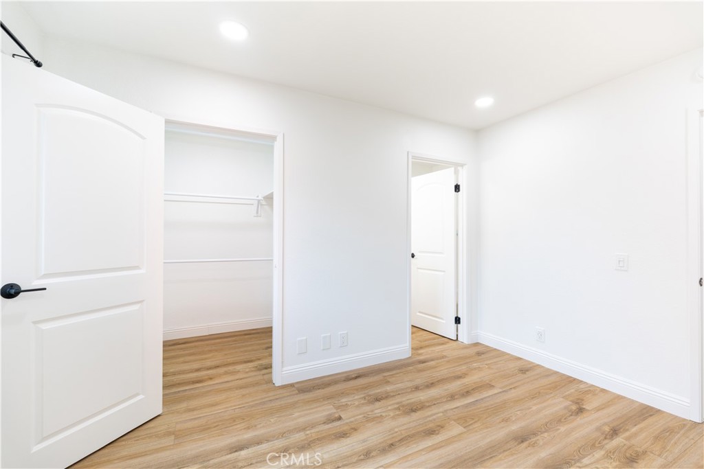 450 East 4th Street, Unit 237 Santa Ana, CA 92701 - Photo 10 of 25 a view of an empty room with wooden floor