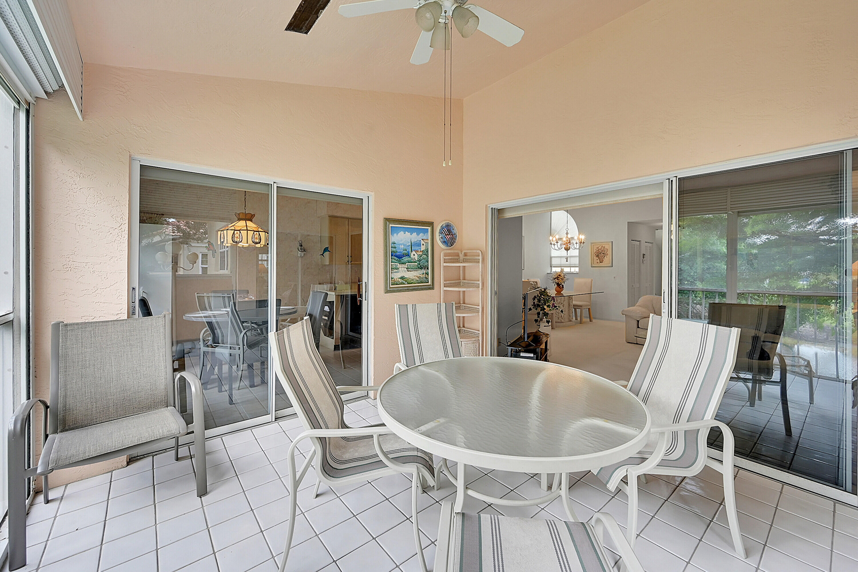 17270 Boca Club Boulevard, Unit 1702 Boca Raton, FL 33487 - Photo 12 of 41 a dining room with furniture and wooden floor