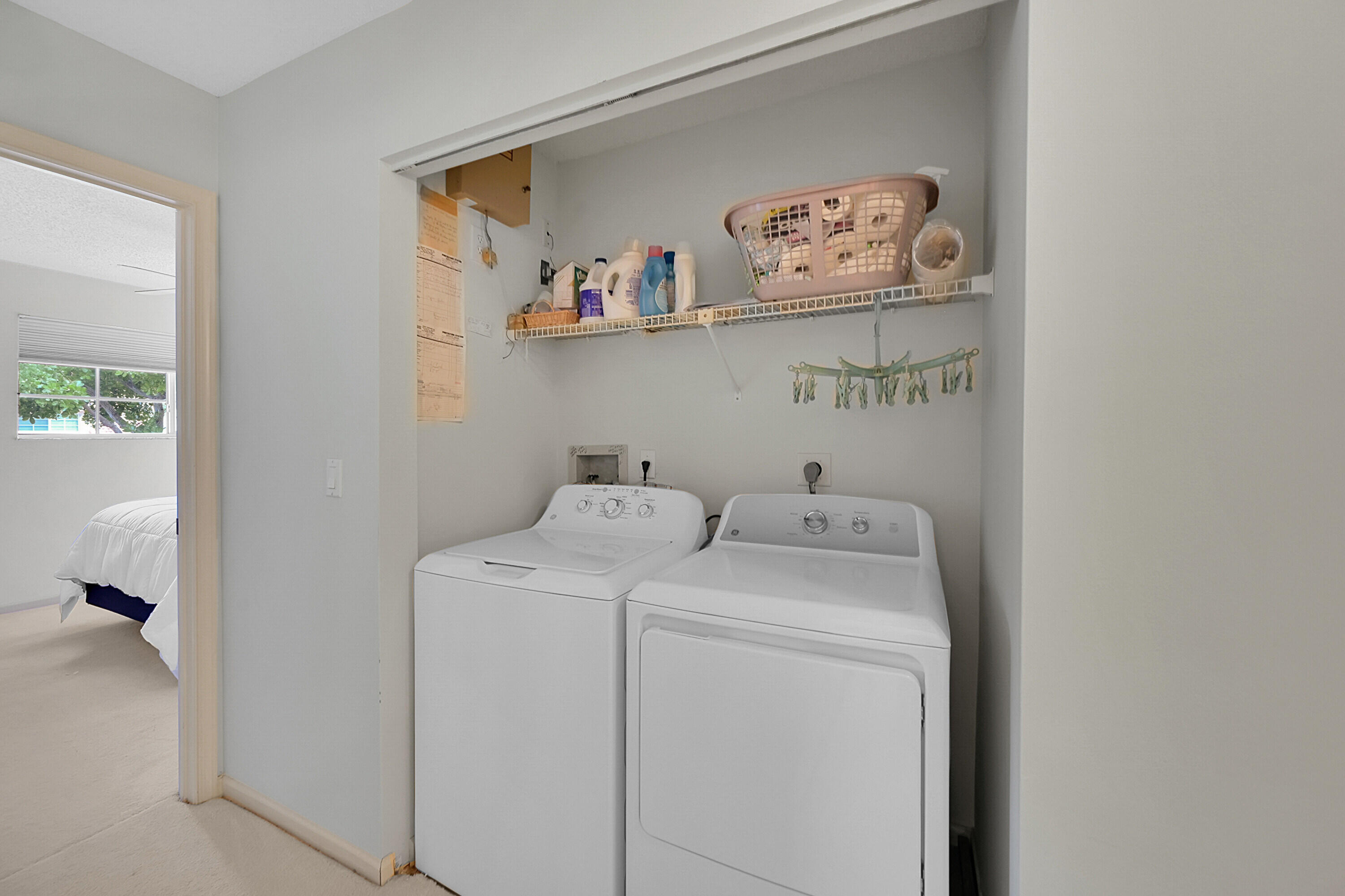 17270 Boca Club Boulevard, Unit 1702 Boca Raton, FL 33487 - Photo 28 of 41 a utility room with dryer and washer