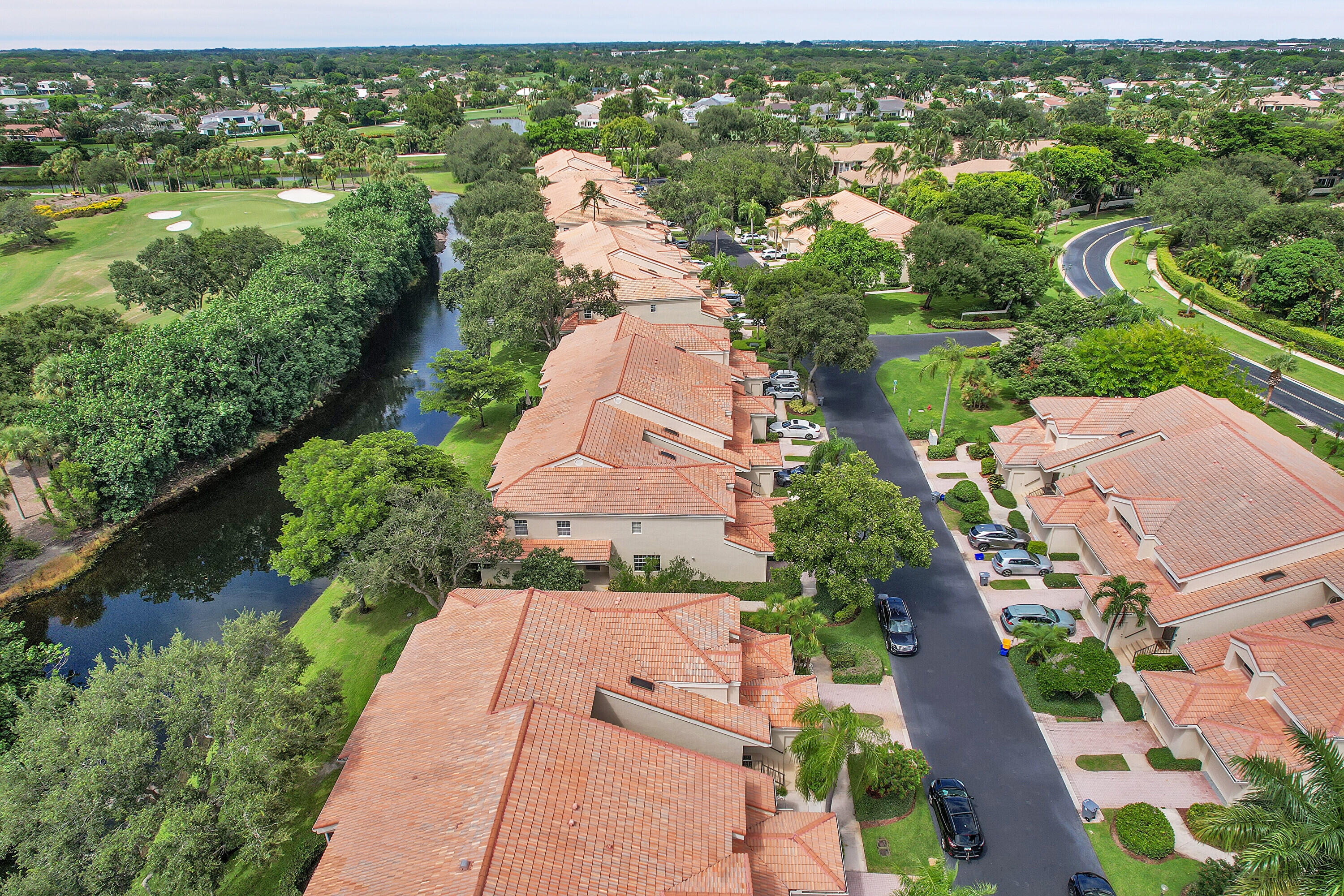 17270 Boca Club Boulevard, Unit 1702 Boca Raton, FL 33487 - Photo 38 of 41 an aerial view of residential houses with outdoor space and river