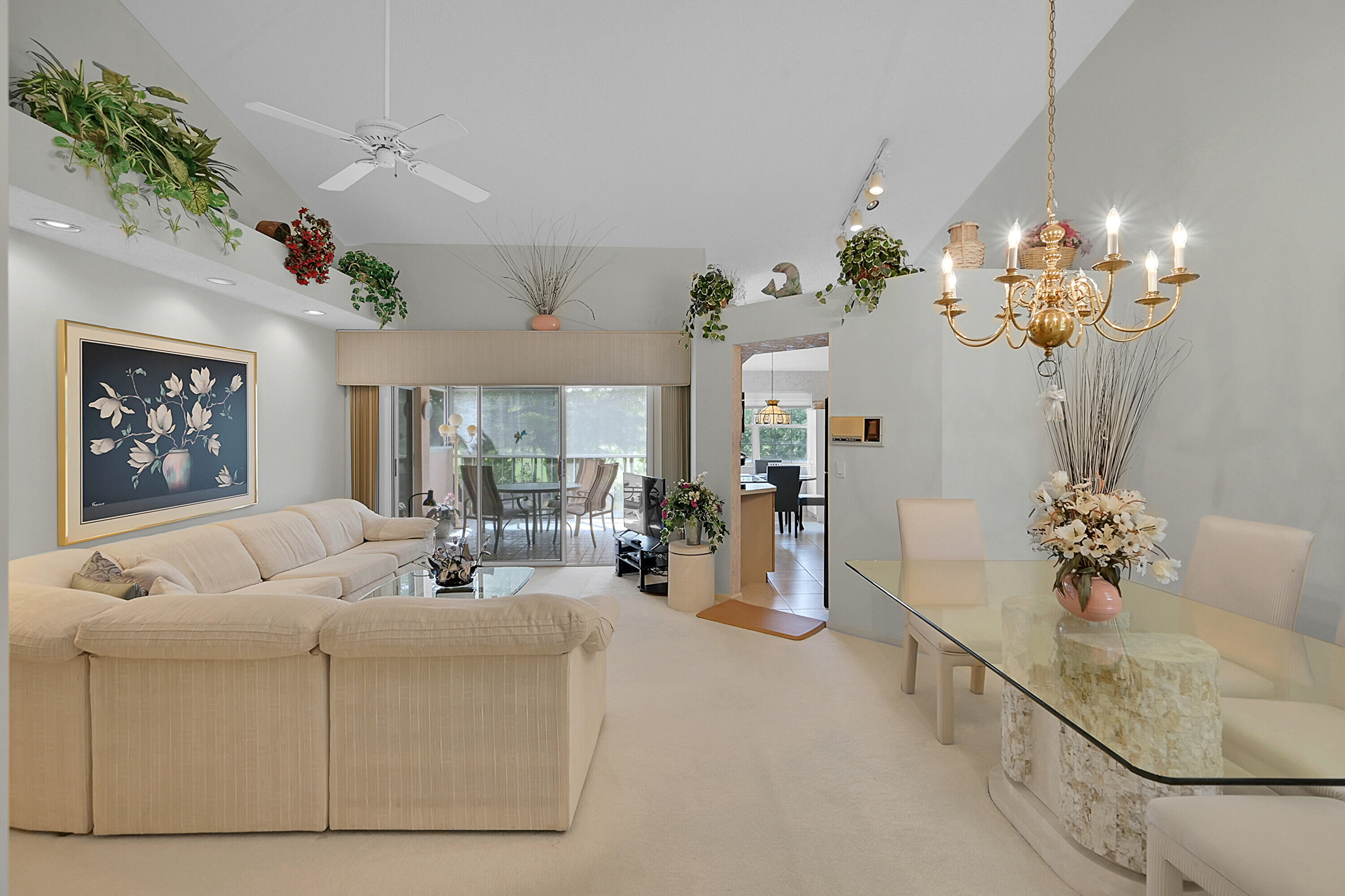 17270 Boca Club Boulevard, Unit 1702 Boca Raton, FL 33487 - Photo 5 of 41 a living room with furniture chandelier and a chandelier