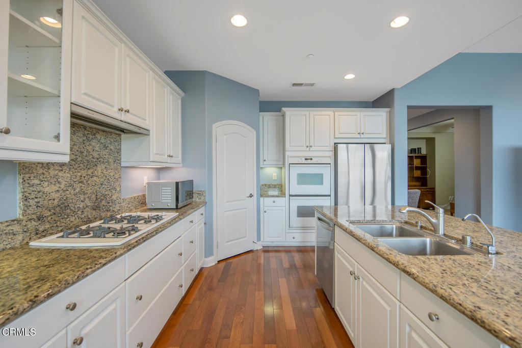 2920 Naples Drive Oxnard, CA 93035 - Photo 11 of 28 a kitchen with stainless steel appliances granite countertop a sink stove and refrigerator