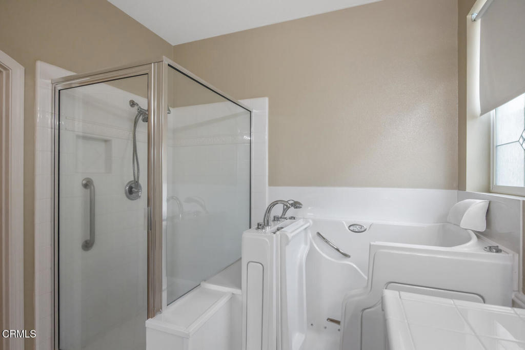 2920 Naples Drive Oxnard, CA 93035 - Photo 20 of 28 a bathroom with a bathtub and shower