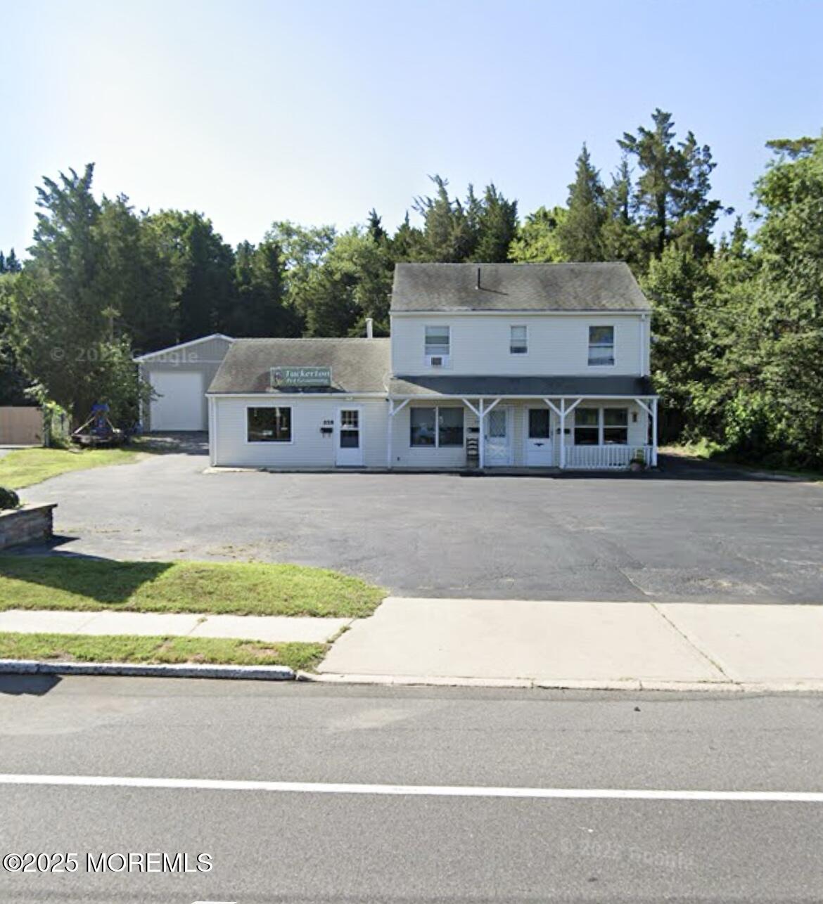 a view of house with a outdoor space and street view