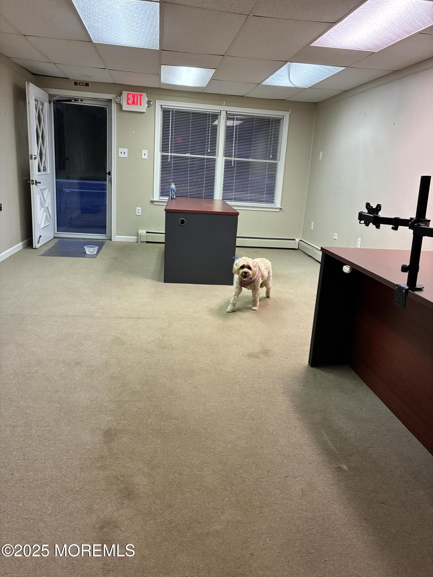 328 East Main Street, Unit C Tuckerton, NJ 08087 - Photo 12 of 19 an empty room with furniture and windows