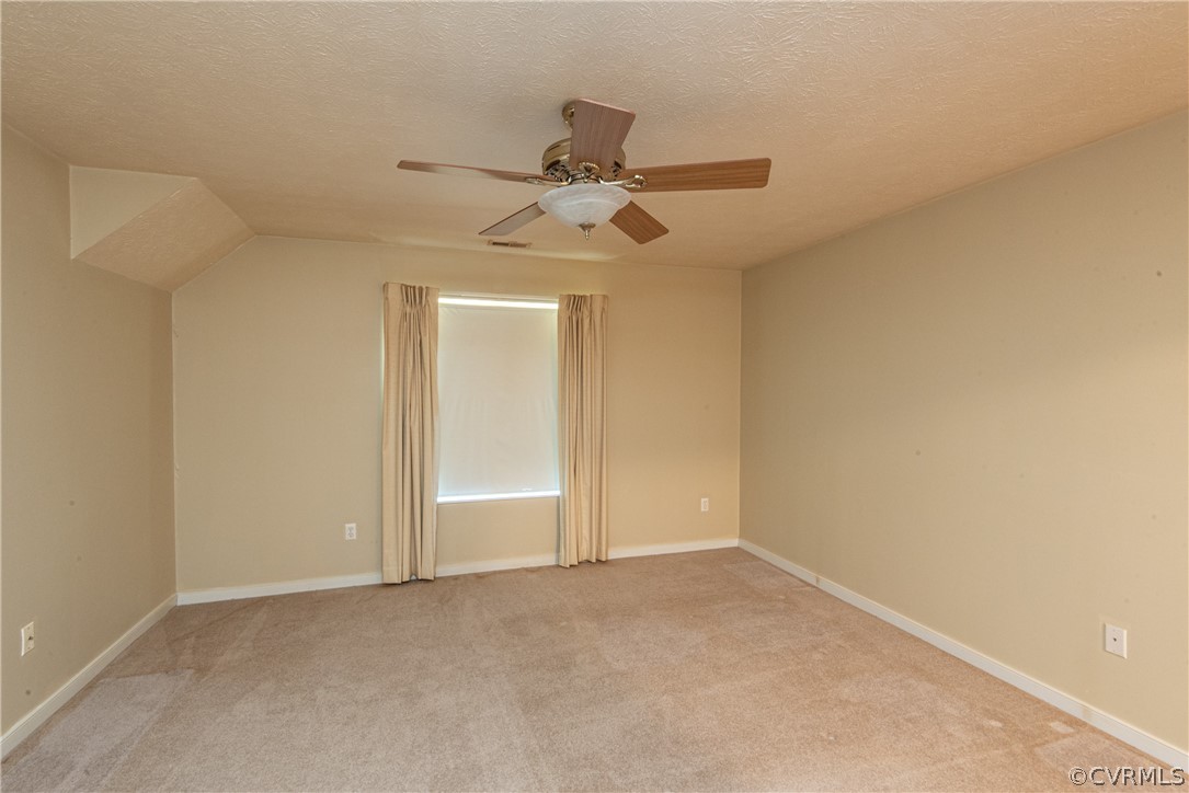 3327 Stone Manor Circle, Unit 9B Chester, VA 23831 - Photo 13 of 27 an empty room with chandelier fan