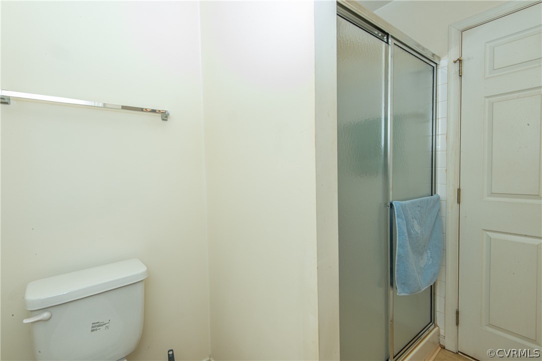 3327 Stone Manor Circle, Unit 9B Chester, VA 23831 - Photo 17 of 27 a bathroom with a shower and toilet