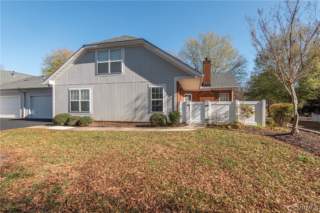 3327 Stone Manor Circle, Unit 9B Chester, VA 23831 - Photo 2 of 27 a front view of a house with a yard