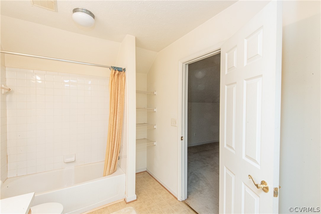 3327 Stone Manor Circle, Unit 9B Chester, VA 23831 - Photo 26 of 27 a bathroom with a glass shower door