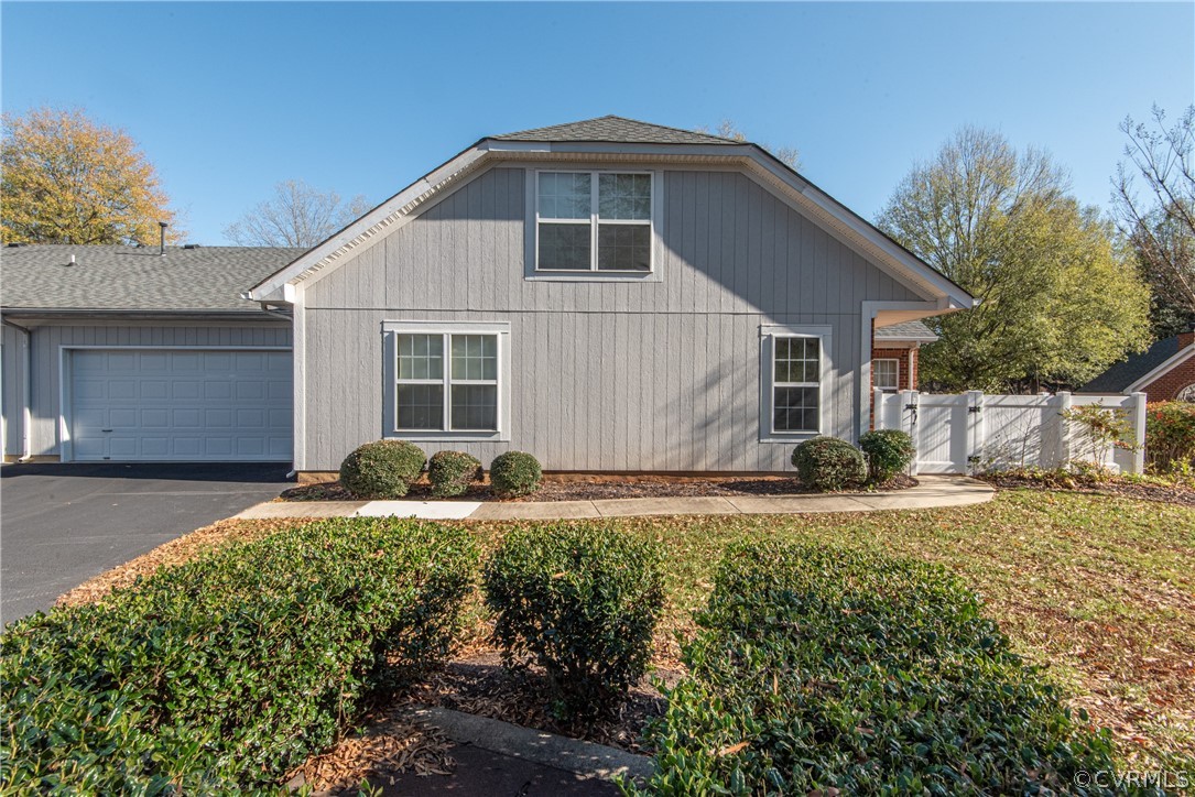 3327 Stone Manor Circle, Unit 9B Chester, VA 23831 - Photo 3 of 27 a front view of house with yard and trees in the background