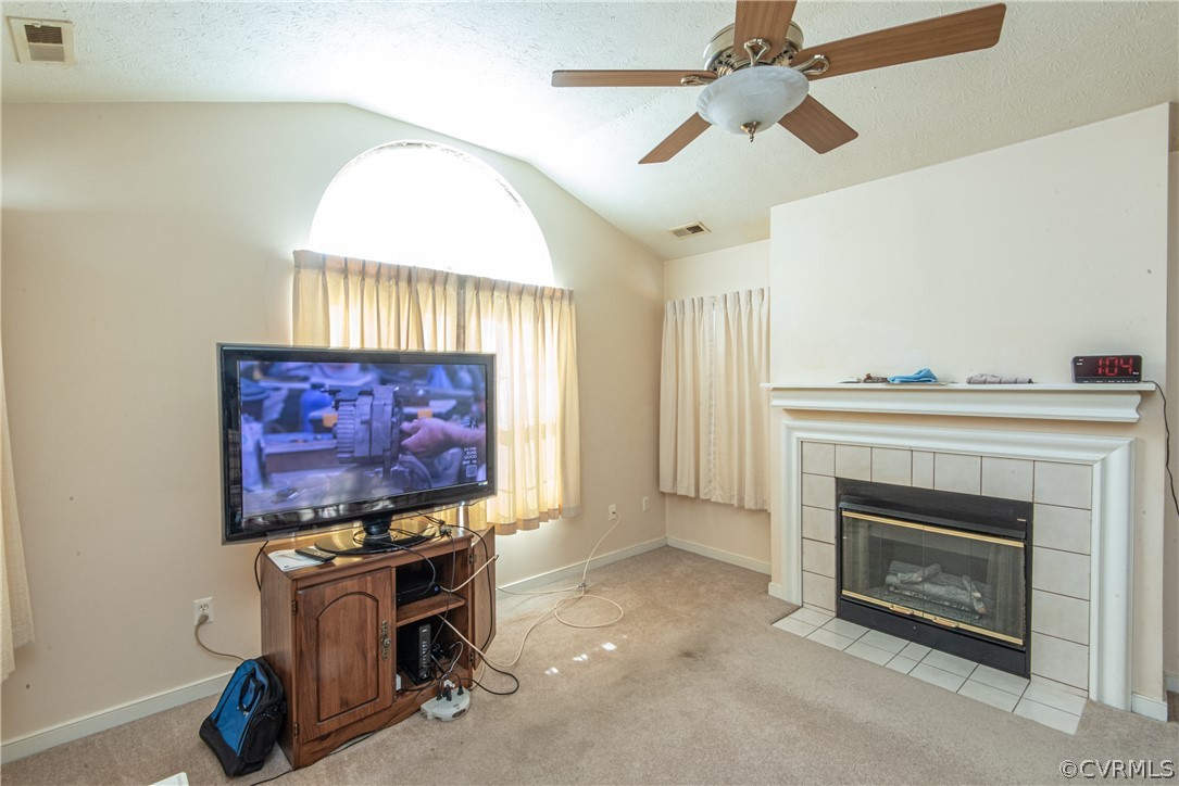 3327 Stone Manor Circle, Unit 9B Chester, VA 23831 - Photo 7 of 27 a living room with furniture a fireplace and a flat screen tv