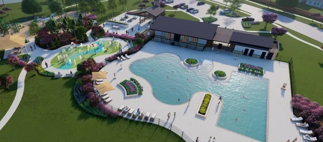 swimming pool view with a garden space