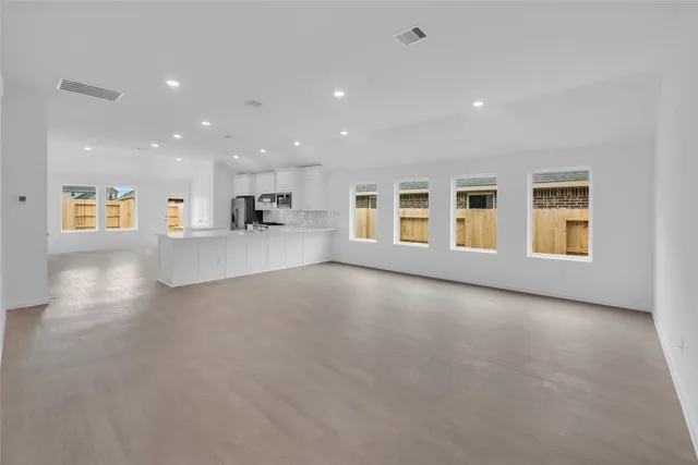 a view of a kitchen with a sink and microwave