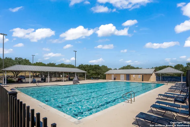 a view of park with swings and slides