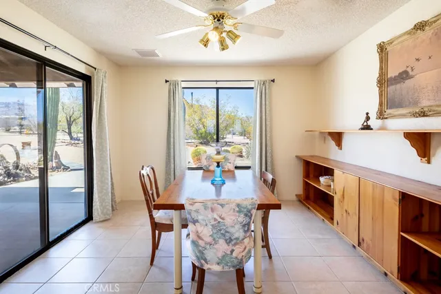 a kitchen that has a lot of cabinets in it and kitchen island