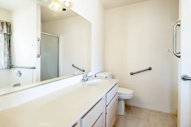 a view of a room with furniture and a floor to ceiling window