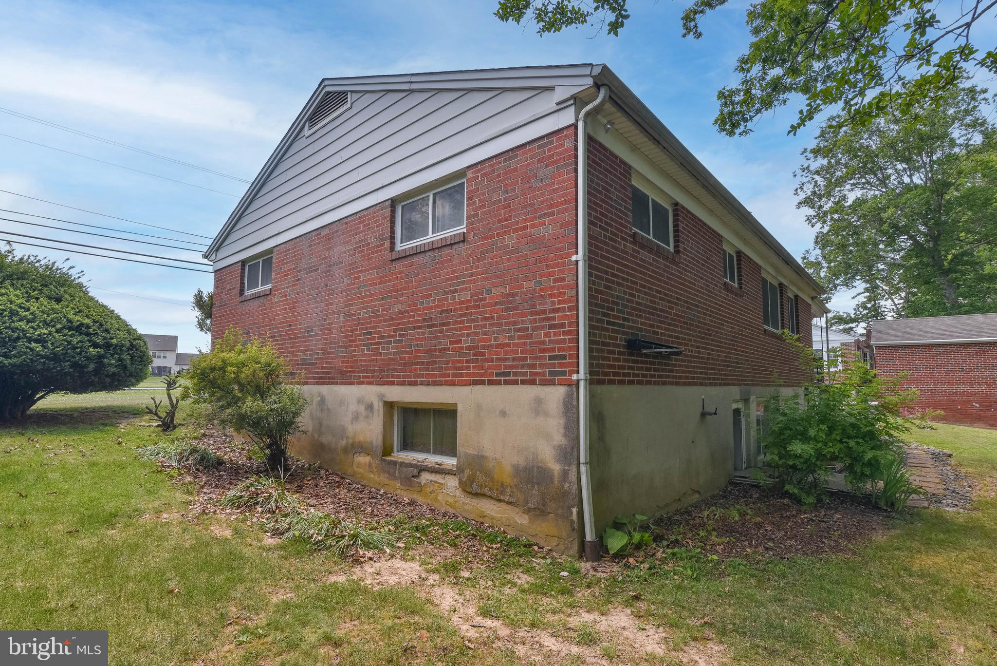 4428 Forge Road Perry Hall, MD 21128 - Photo 24 of 27 a front view of a house with garden