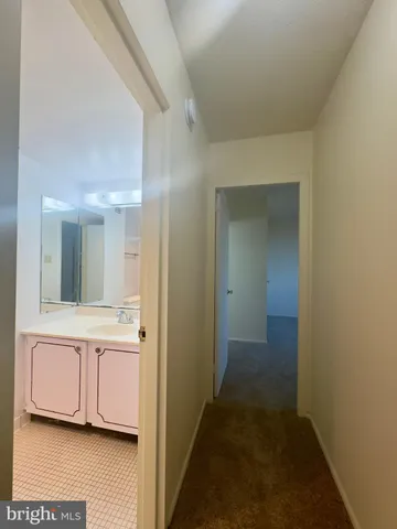 a view of a bathroom from the hallway