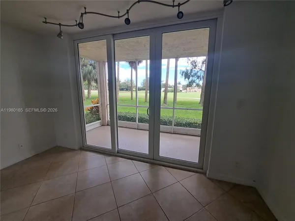 a view of an empty room with a sliding door